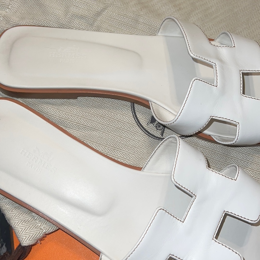 White Hermès Oran Sandals Worn a couple times on vacation.
